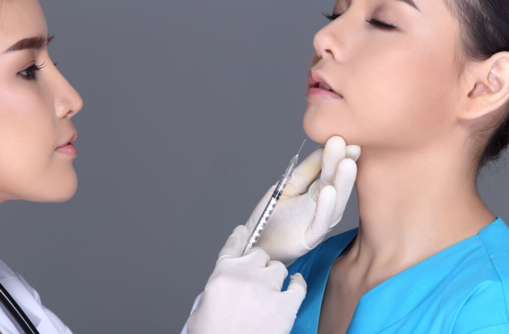 A patient receiving botox in their jaw.